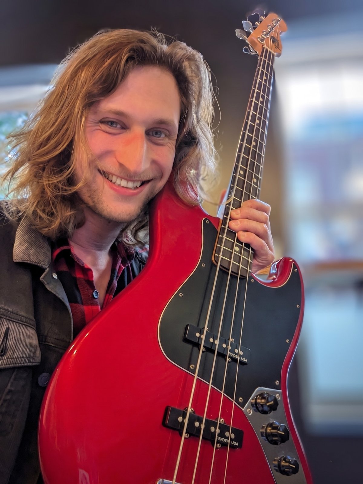 Freddie Draper holding a Fender bass